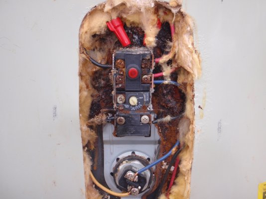 Melted lower left terminal of upper thermostat.JPG