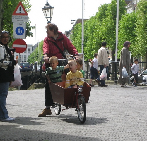 Mom and her kids on a wheelbarrow bike near Gouda Holland, 4-29-09