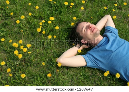 stock-photo-young-man-lying-on-the-grass-1289649.jpg