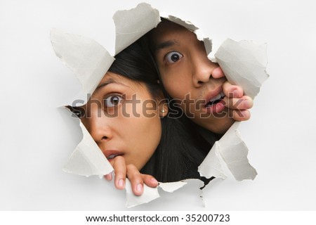 stock-photo-two-people-peeking-from-hole-in-wall-35200723.jpg