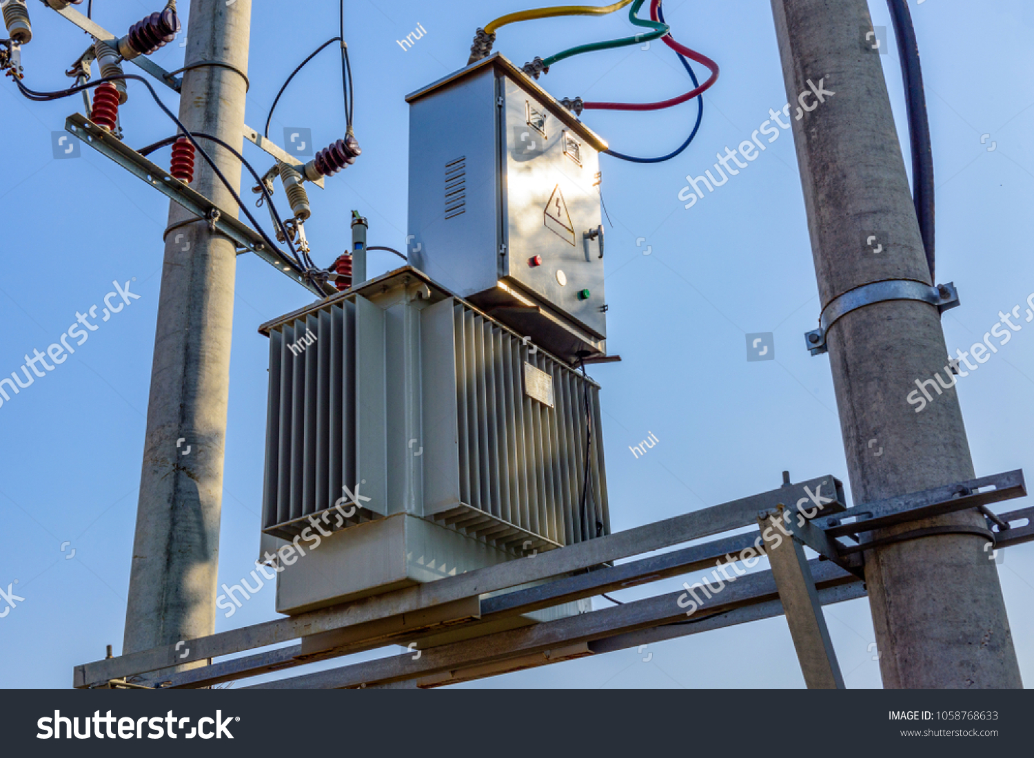 stock-photo-pole-mounted-distribution-transformer-for-residential-and-light-commercial-service-pole-mounted-1058768633.jpg
