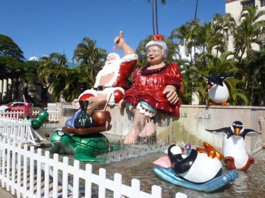 Mele Kalikimaka-- Shaka Santa and Mrs Claus at Honolulu Hale.jpg