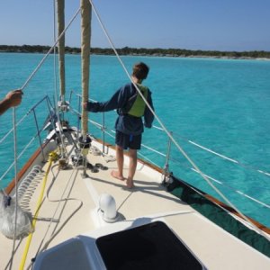 Teaching my son how to drop the anchor off Great Exuma island.