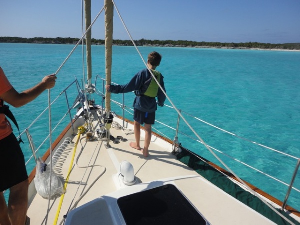 Teaching my son how to drop the anchor off Great Exuma island.