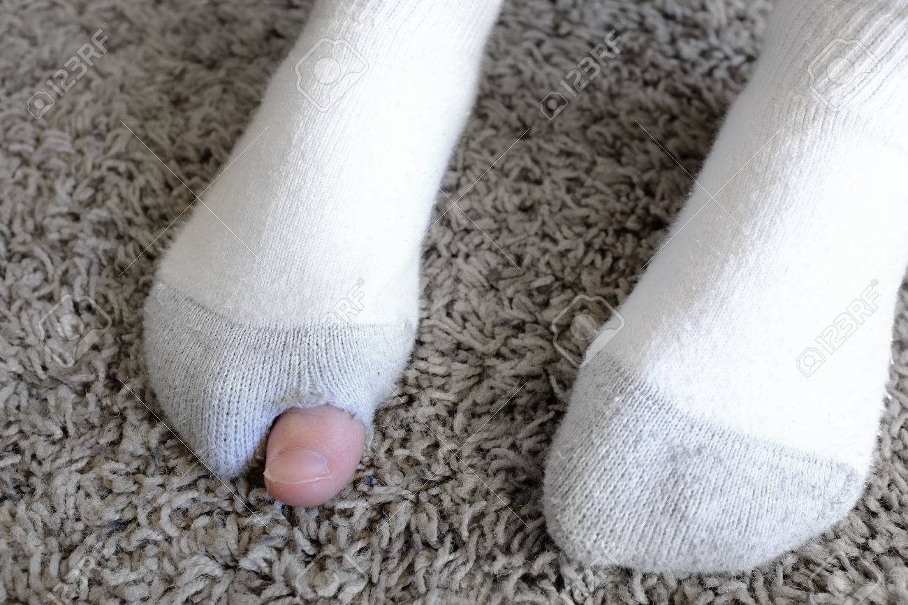 51981643-detail-of-white-socks-poor-person-hole-holey-worn-out.jpg
