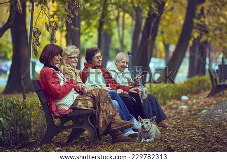 stock-photo-bucharest-romania-october-four-unidentified-happy-retired-women-rest-on-a-bench-and-229782313.jpg